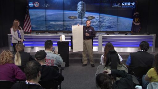 Gary Ruff, SAFFIRE Investigator, demonstrates the size of the combustion sample to media - Photo: NASA
