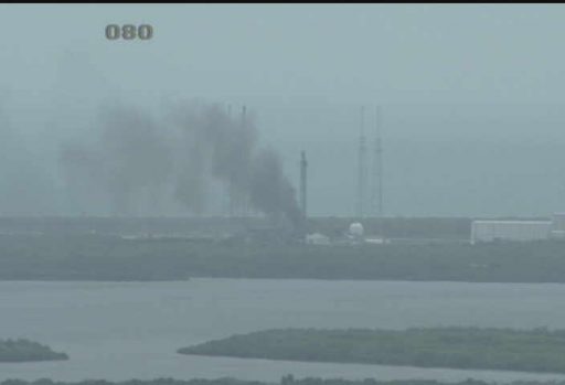 Smoke still rises from SLC-40 three hours after the incident - Photo: NASA KSC Webcam