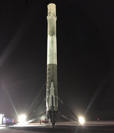 The Falcon 9 Booster atop its flat landing pad after making a historic return to a safe onshore landing. - Credit: SpaceX