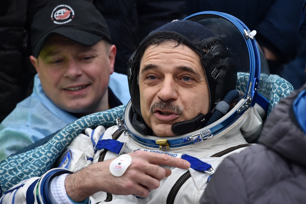 International Space Station (ISS) crew member Mikhail Kornienko of Russia reacts after landing near the town of Dzhezkazgan, Kazakhstan, on March 2, 2016. US astronaut Scott Kelly and Russian cosmonaut Mikhail Kornienko returned to Earth on March 2 after spending almost a year in space in a ground-breaking experiment foreshadowing a potential manned mission to Mars. AFP PHOTO / POOL / KIRILL KUDRYAVTSEV