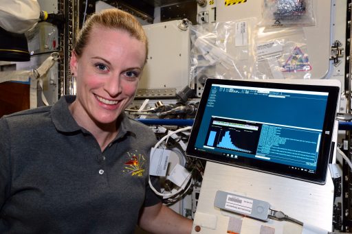 NASA Astronaut Kate Rubins with the Biomolecule Sequencer hardware after the first DNA Sequencing was performed on ISS - Photo: NASA