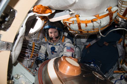 Kate Rubins completes a fit check in her Sokol Suit and Kazbek Seat Liner in the Soyuz Entry Module - Photo: NASA