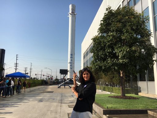 NASA Astronaut Suni Williams in front of the Orbcomm G2 Booster on display at SpaceX HQ - Photo: Sunita Williams/Twitter